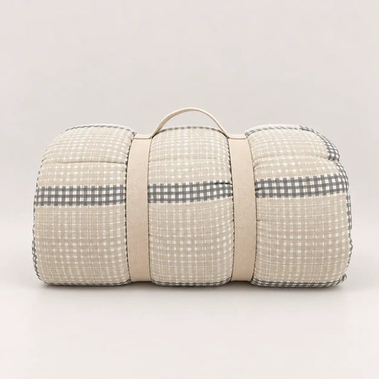 Mid-season duvet with a practical storage handle, showing its main check design in beige and grey tones.
