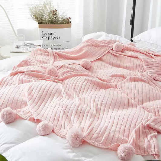 Manta de punto con pompones. Color rosa. - Oma Home