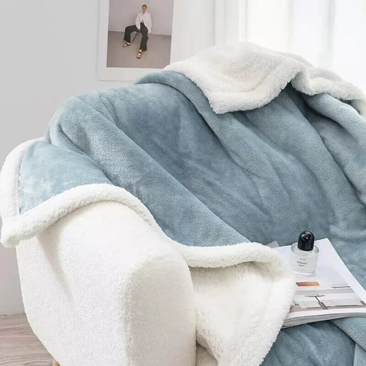 Extra soft reversible shearling blanket with border. Color blue.