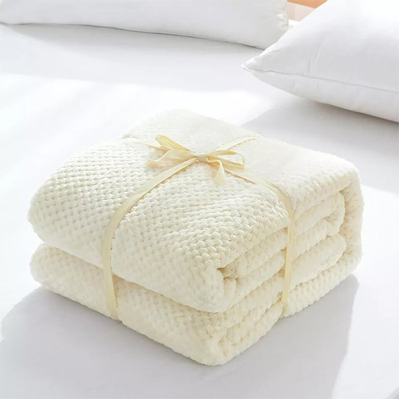 Off-white fleece blanket.