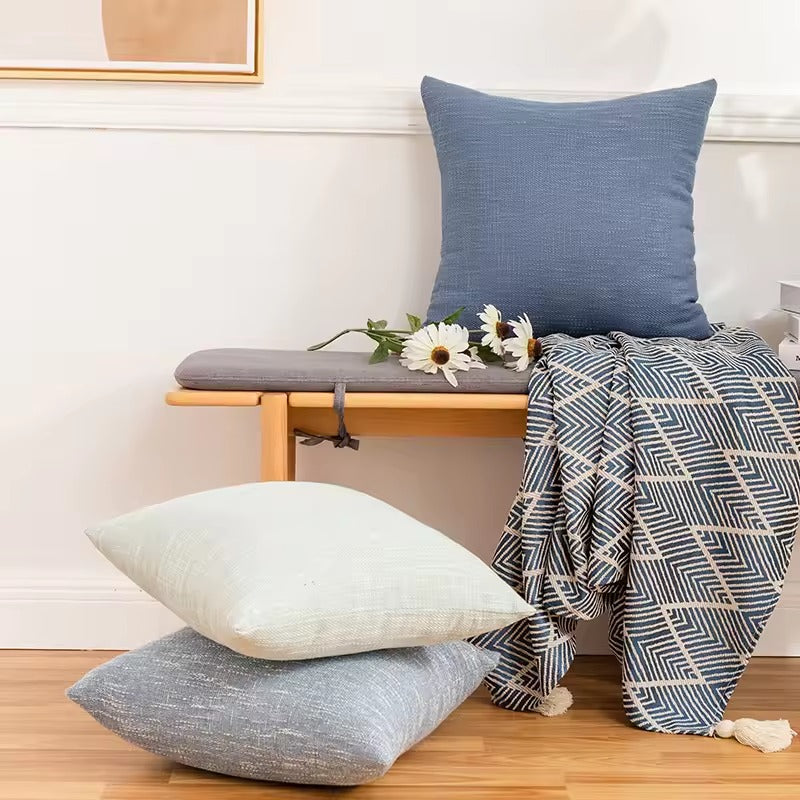 Plain off-white cushion cover with relief.