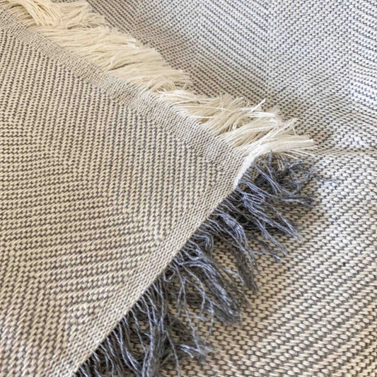 Multipurpose summer quilt for sofa or bed. Light gray color.
