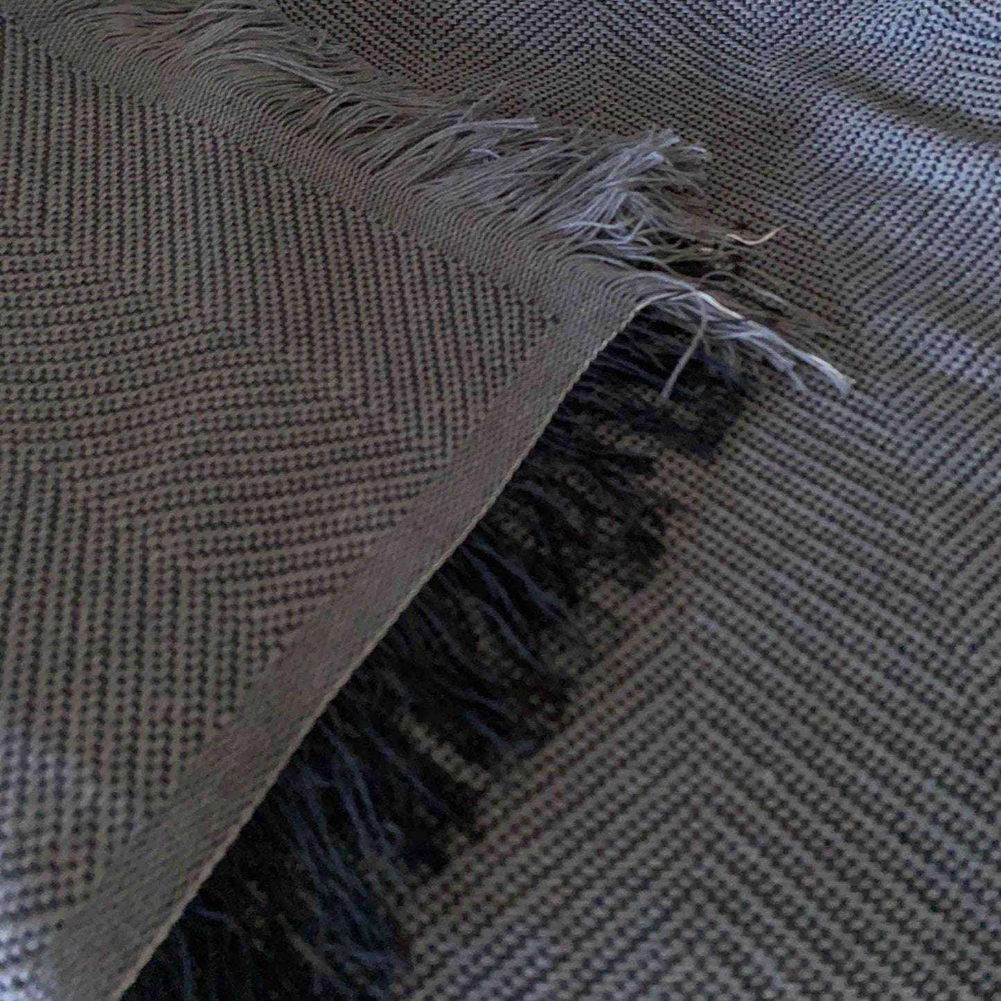 Multipurpose summer quilt for sofa or bed. Dark gray color.