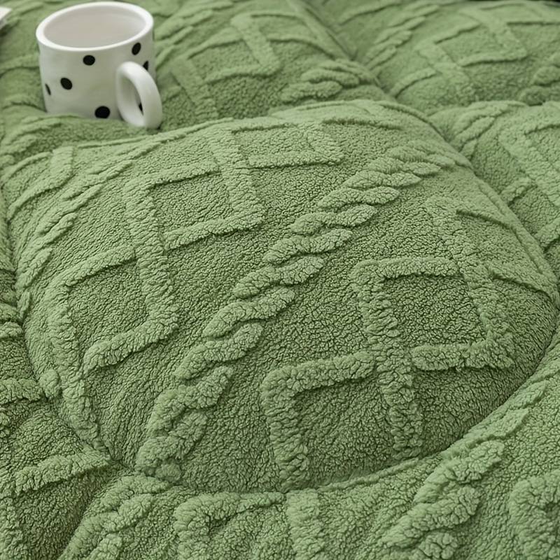 Green winter blanket quilt. Embrace the warmth at every break.