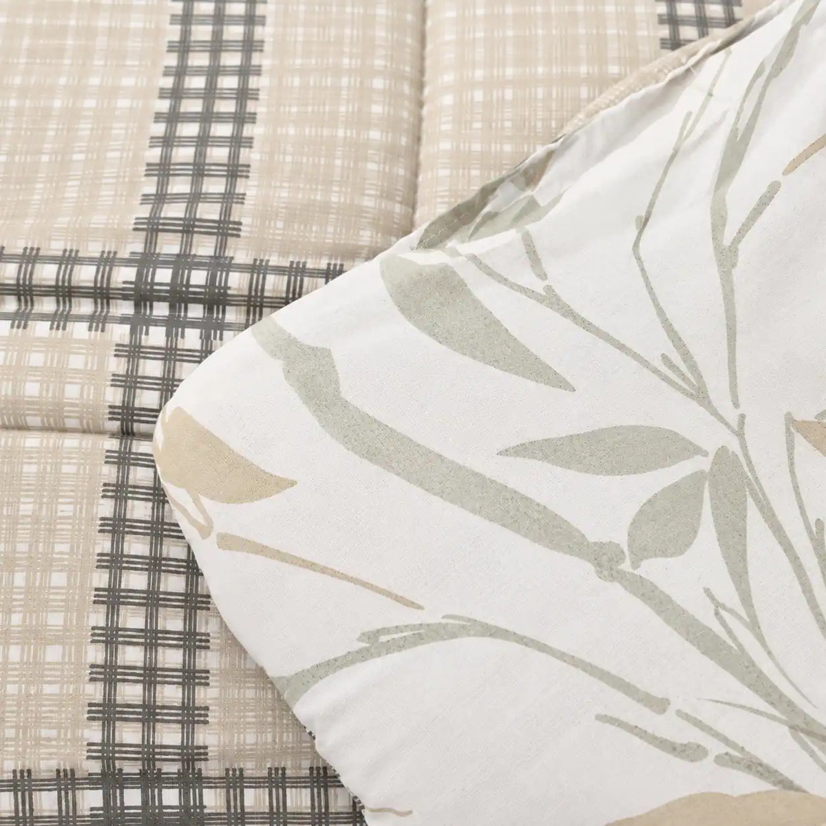 Close-up of the duvet’s main check pattern with crossed lines in warm, neutral tones.