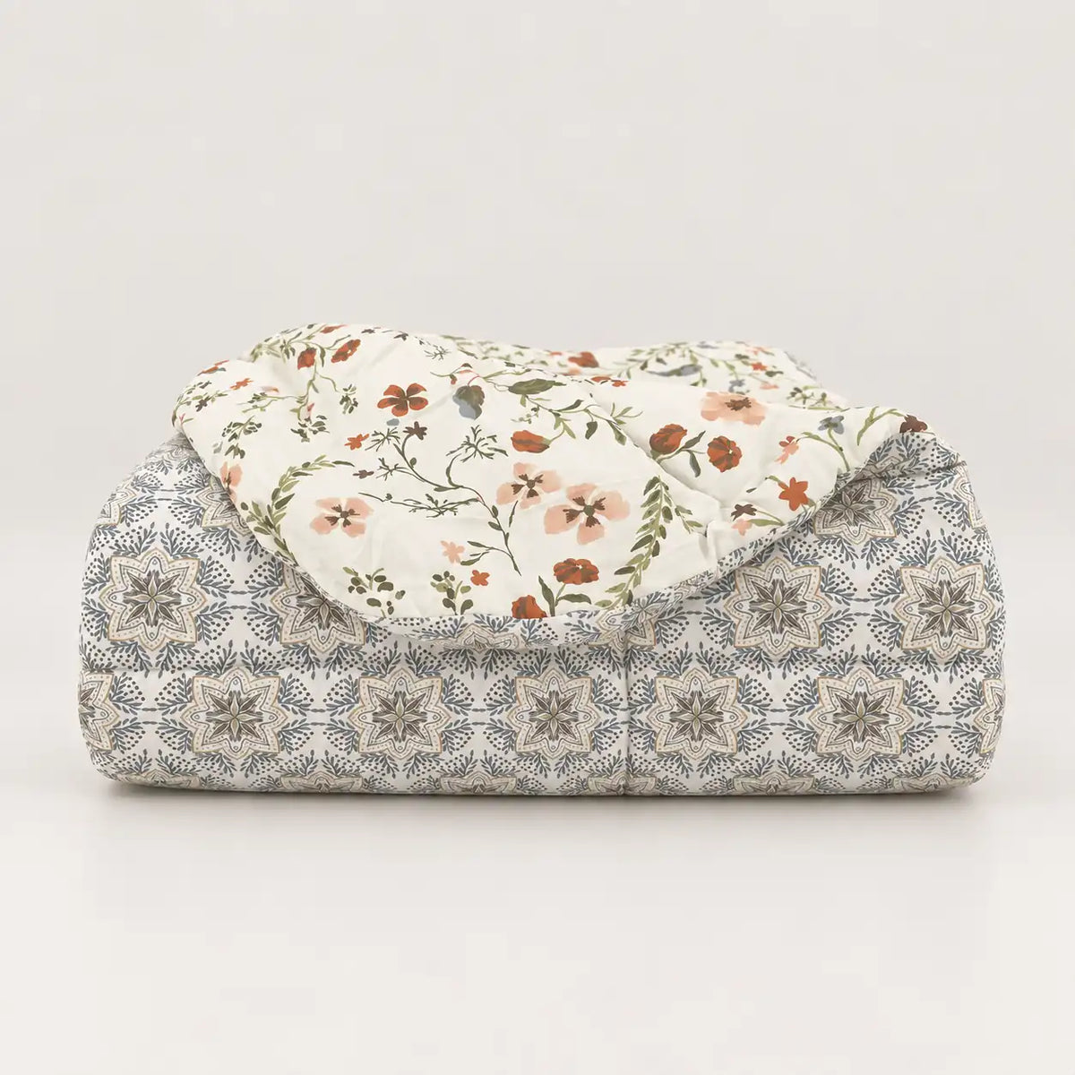Duvet with the reverse folded over to show its geometric pattern.