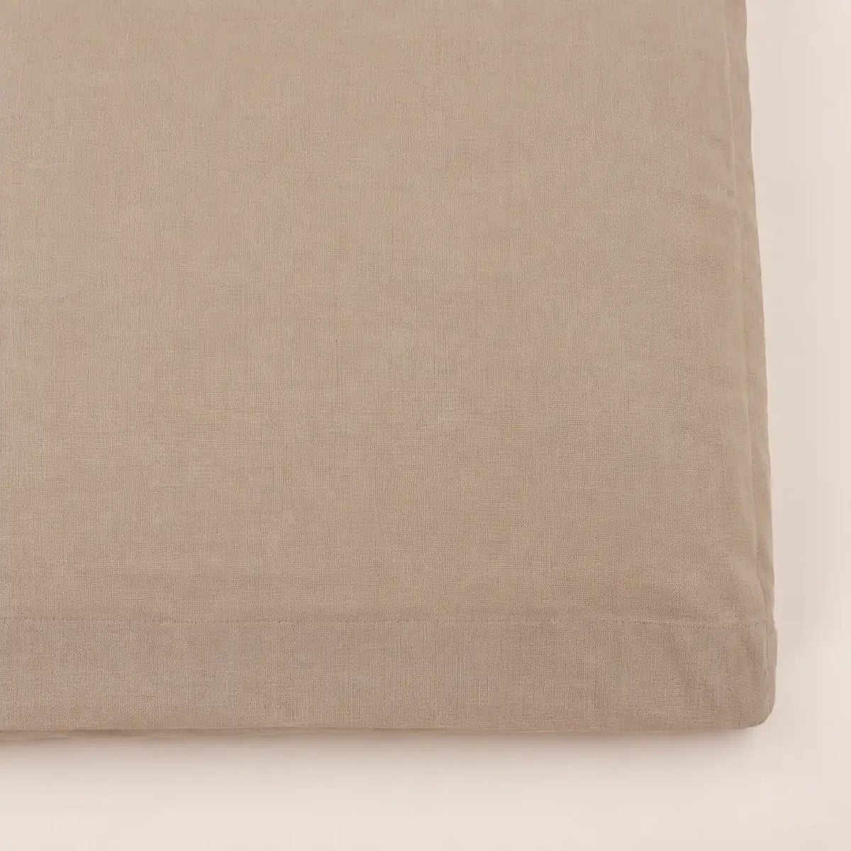 Close-up of the natural cotton fabric in stone brown. - Oma Home