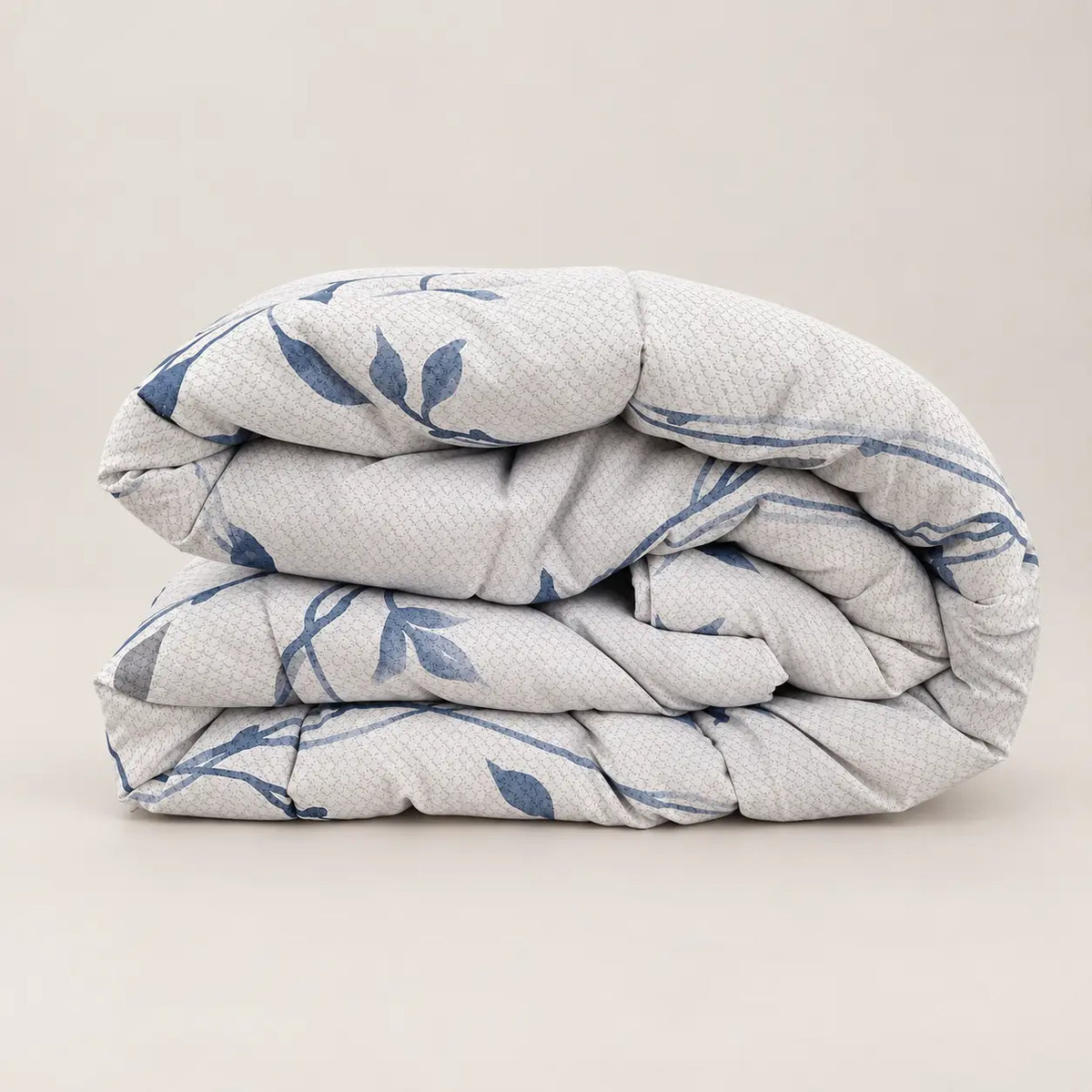 Side view of the 250gsm duvet, highlighting its lightweight loft and the contrast between its two printed sides.