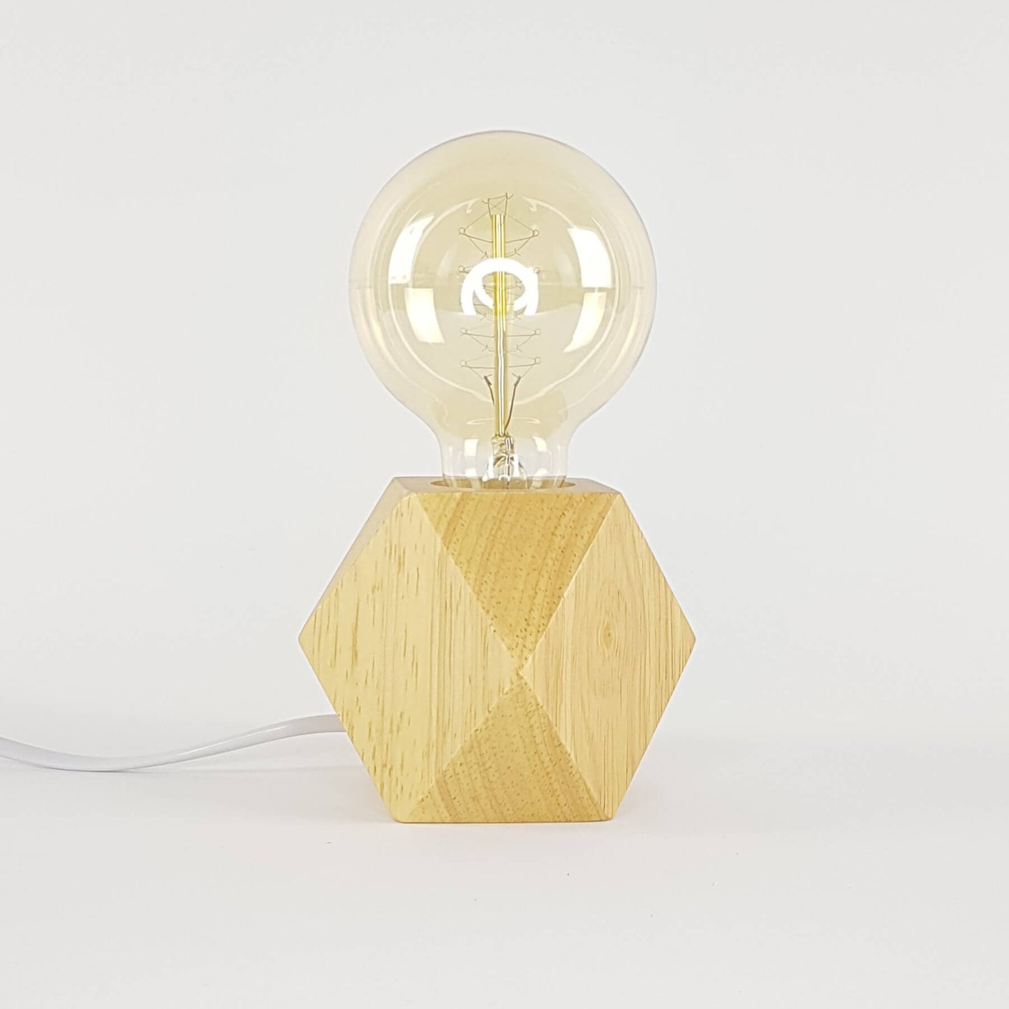 Bedside table lamp with light bulb. Wood with diamond base.