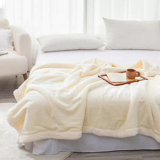 Extra soft reversible shearling blanket with border. Off-white colour.