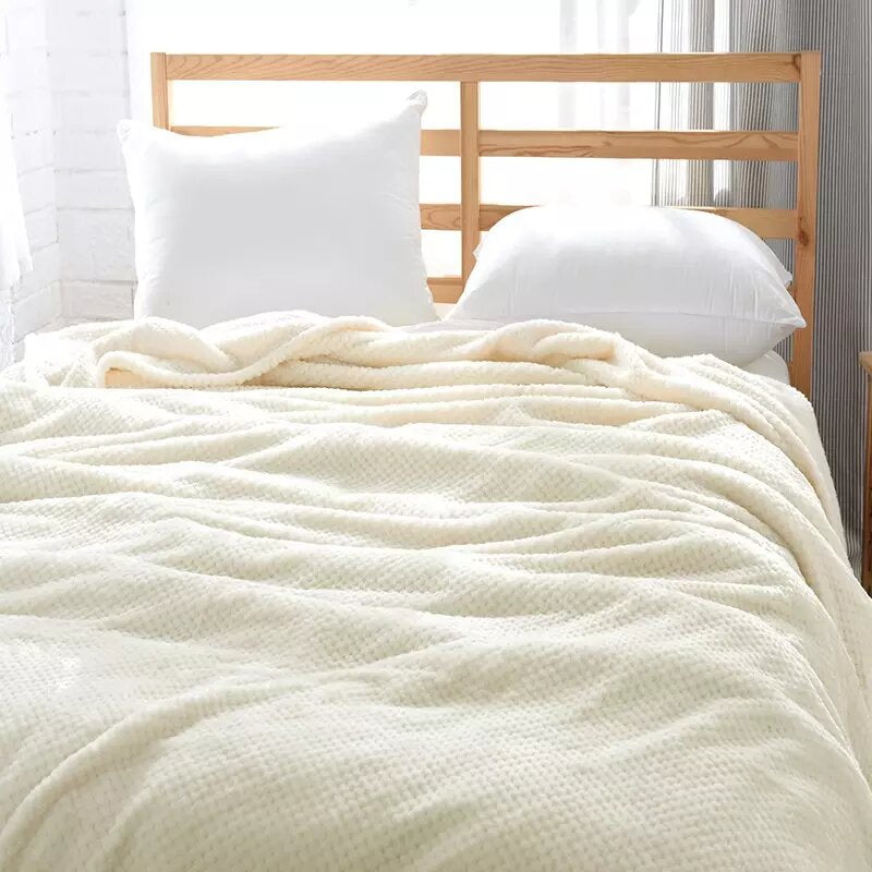 Off-white fleece blanket.