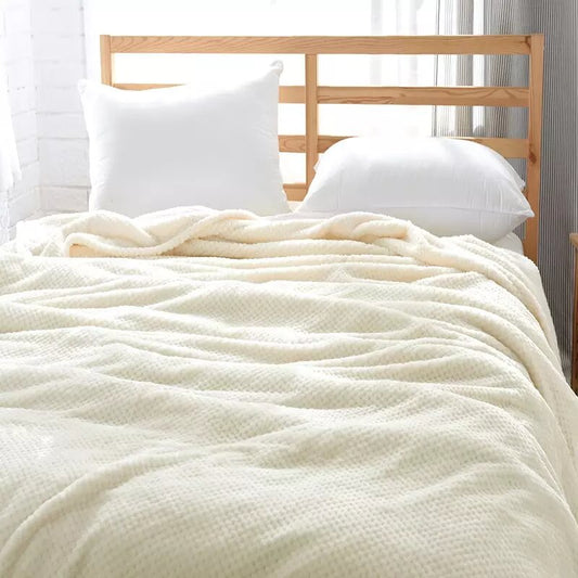 Off-white fleece blanket.